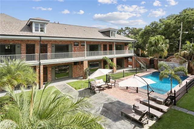 1629 Washington Ave Unit 203, New Orleans, LA 70130 - view of pool with fence, stairway, and a patio area