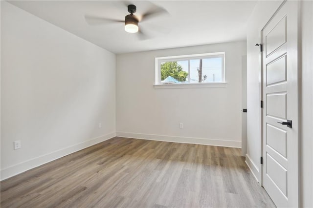 1629 Washington Ave Unit 203, New Orleans, LA 70130 - empty room featuring wood finished floors, ceiling fan, and baseboards