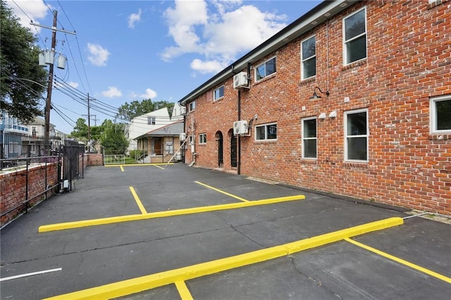 1629 Washington Ave Unit 203, New Orleans, LA 70130 - uncovered parking lot featuring fence