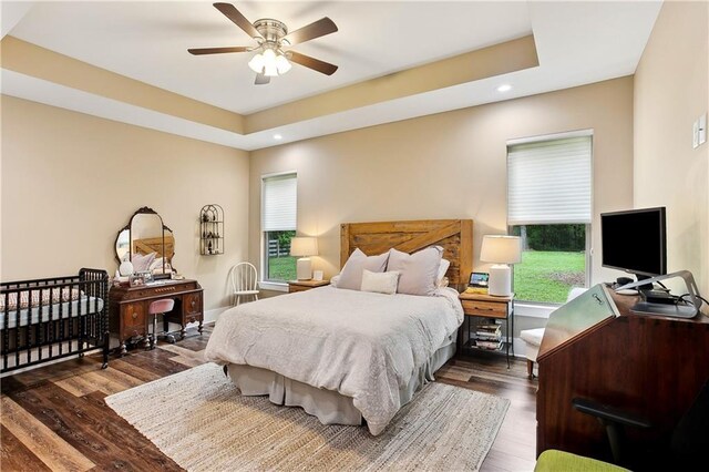 bedroom featuring recessed lighting, multiple windows, and wood finished floors