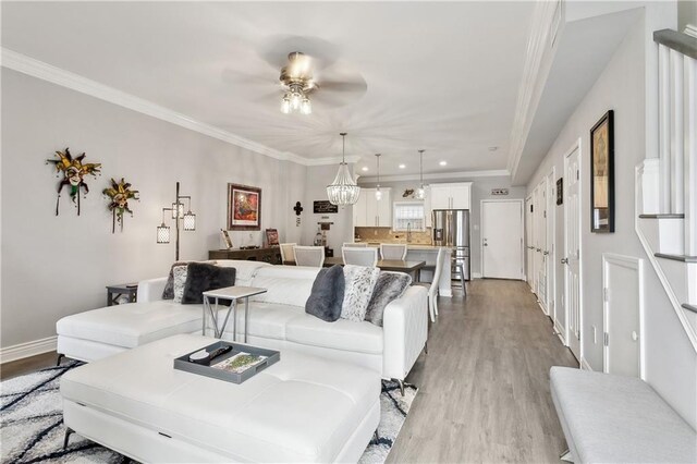 1904 Jena St, New Orleans, LA 70115 - living area featuring light wood-style flooring, crown molding, baseboards, and ceiling fan