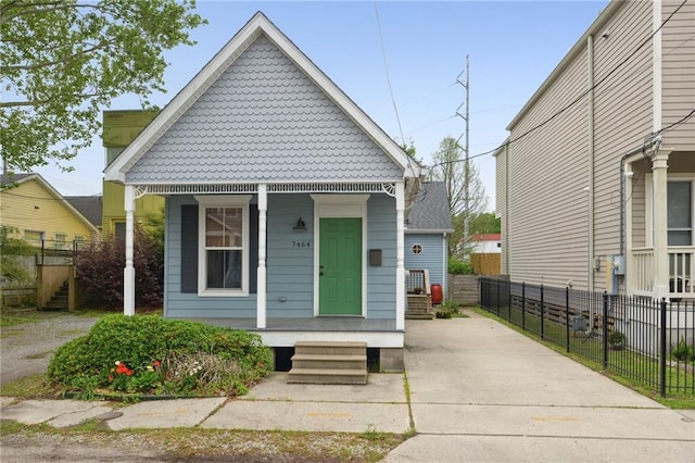 7464 Pitt St, New Orleans, LA 70118 - view of front of house with a porch