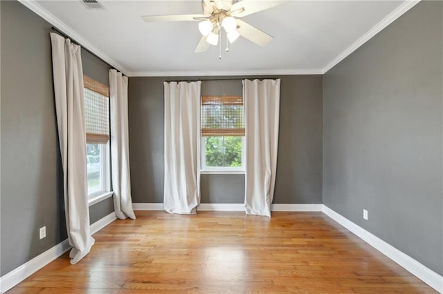 7464 Pitt St, New Orleans, LA 70118 - empty room featuring crown molding, ceiling fan, and light wood-style floors