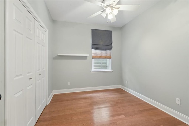 7464 Pitt St, New Orleans, LA 70118 - unfurnished bedroom with a closet, wood finished floors, and ceiling fan