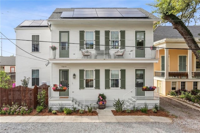 1217 N Tonti St, New Orleans, LA 70119 - view of front of house featuring solar panels and a balcony