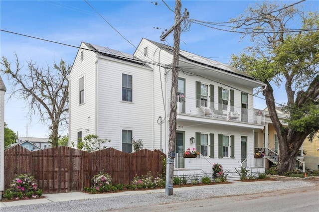 1217 N Tonti St, New Orleans, LA 70119 - view of front of house featuring a balcony and solar panels