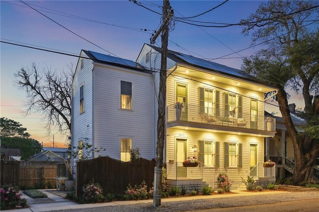 1217 N Tonti St, New Orleans, LA 70119 - view of front of home featuring solar panels and a balcony