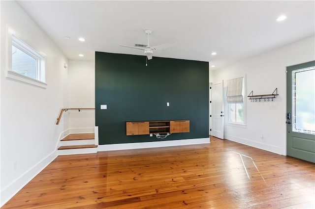1217 N Tonti St, New Orleans, LA 70119 - unfurnished living room with hardwood / wood-style flooring, recessed lighting, a ceiling fan, and stairs