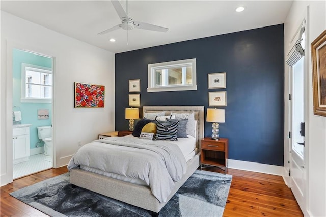 1217 N Tonti St, New Orleans, LA 70119 - bedroom featuring hardwood / wood-style flooring, recessed lighting, ensuite bathroom, ceiling fan, and an accent wall