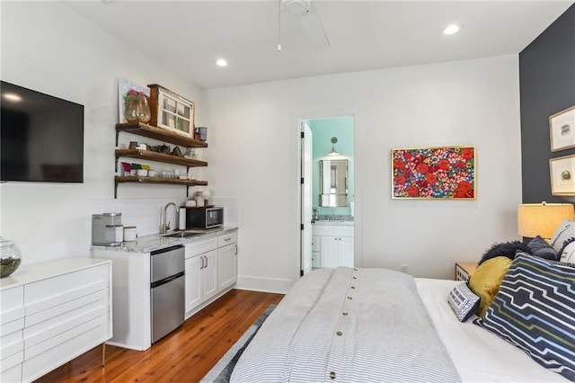 1217 N Tonti St, New Orleans, LA 70119 - bedroom with fridge, dark wood-style flooring, ensuite bath, recessed lighting, and a ceiling fan