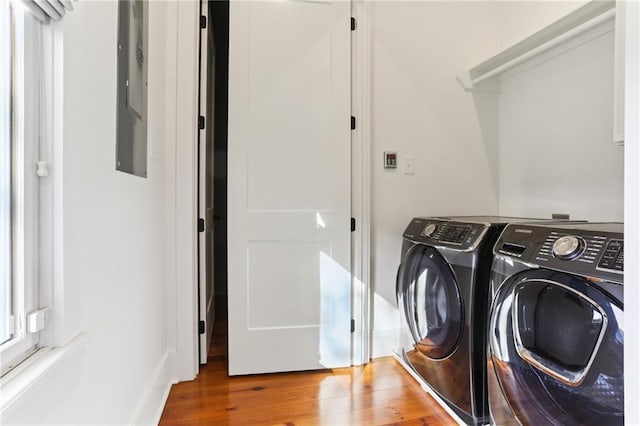 1217 N Tonti St, New Orleans, LA 70119 - laundry room with separate washer and dryer and wood finished floors