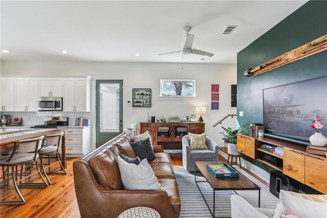 1217 N Tonti St, New Orleans, LA 70119 - living room featuring light wood-type flooring, ceiling fan, and recessed lighting