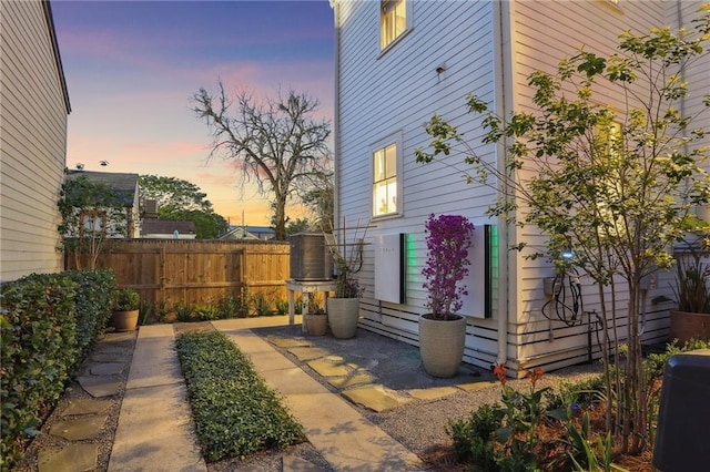 1217 N Tonti St, New Orleans, LA 70119 - property exterior at dusk with a patio area