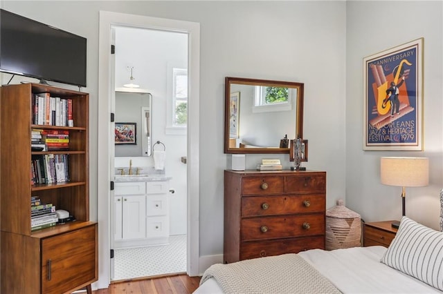 1217 N Tonti St, New Orleans, LA 70119 - bedroom featuring wood finished floors and ensuite bathroom