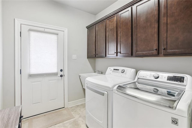 516 Tallow Tree Dr, Madisonville, LA 70447 - clothes washing area with baseboards, cabinet space, separate washer and dryer, and a sink
