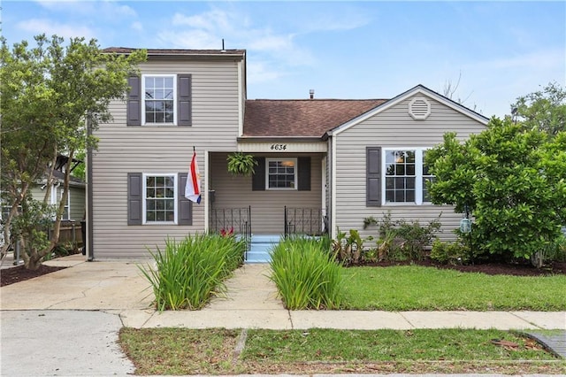 4634 Frenchmen St, New Orleans, LA 70122 - view of front of property with roof with shingles