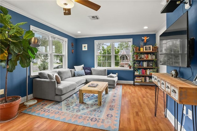 4634 Frenchmen St, New Orleans, LA 70122 - living room featuring ornamental molding, visible vents, and a healthy amount of sunlight