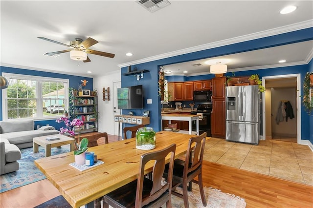 4634 Frenchmen St, New Orleans, LA 70122 - dining area with visible vents, crown molding, recessed lighting, a ceiling fan, and light tile patterned floors