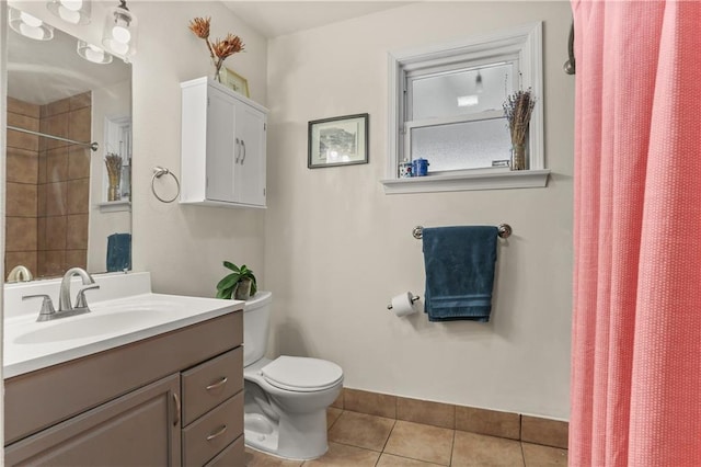4634 Frenchmen St, New Orleans, LA 70122 - bathroom with tile patterned flooring, vanity, curtained shower, and toilet