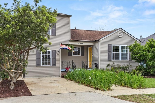 4634 Frenchmen St, New Orleans, LA 70122 - view of front of house featuring a shingled roof