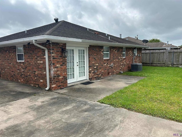 3404 Veronica Dr, Chalmette, LA 70043 - rear view of house featuring a patio, brick siding, roof with shingles, and french doors