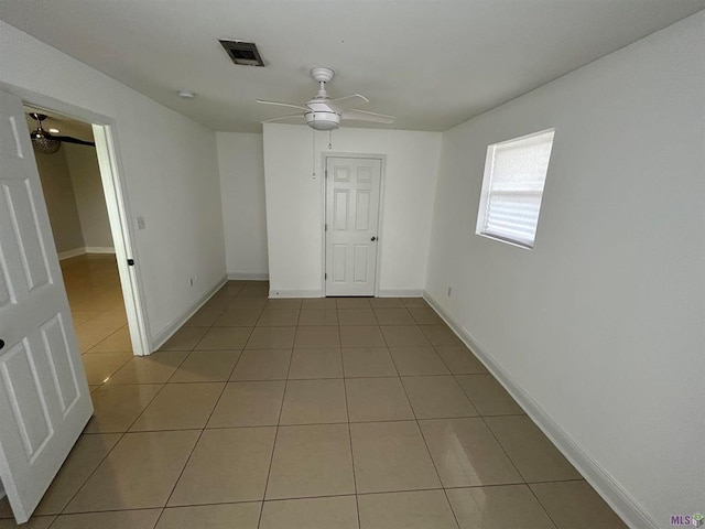 3404 Veronica Dr, Chalmette, LA 70043 - unfurnished room featuring light tile patterned floors, a ceiling fan, and baseboards