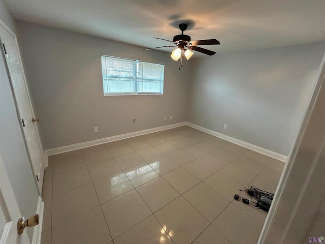3404 Veronica Dr, Chalmette, LA 70043 - spare room with ceiling fan, tile patterned flooring, and baseboards