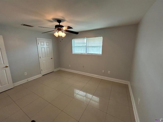 3404 Veronica Dr, Chalmette, LA 70043 - spare room featuring a ceiling fan, baseboards, and tile patterned floors