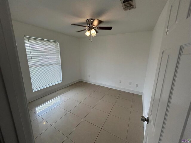 3404 Veronica Dr, Chalmette, LA 70043 - unfurnished room featuring a ceiling fan, light tile patterned flooring, and baseboards