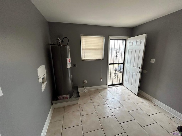 3404 Veronica Dr, Chalmette, LA 70043 - foyer entrance featuring electric water heater, baseboards, and light tile patterned floors