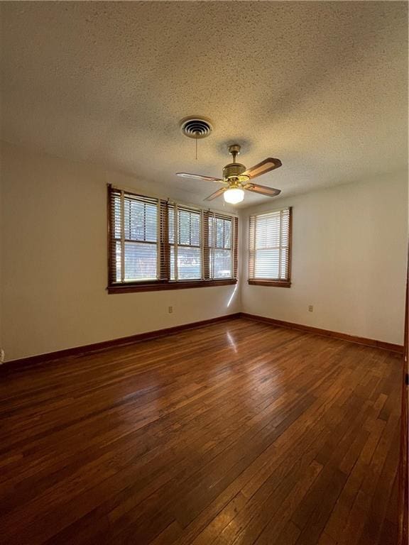 65 Willow Dr, Gretna, LA 70053 - unfurnished room with a ceiling fan, a textured ceiling, dark wood-style floors, baseboards, and visible vents