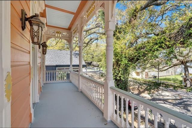 balcony with a porch and a water view