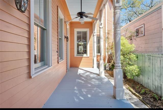 view of patio / terrace with fence and ceiling fan