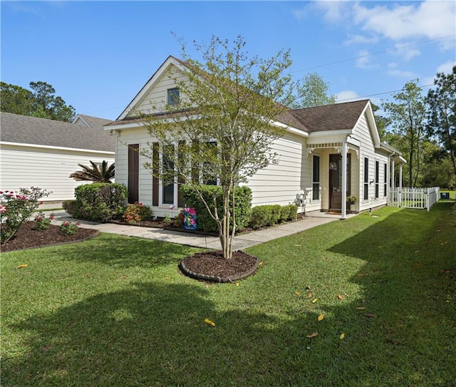 180 Cross Creek Dr Unit B, Slidell, LA 70461 - view of front of home featuring roof with shingles, a front lawn, and fence