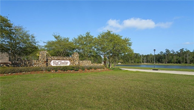 exterior space with a lawn and a water view