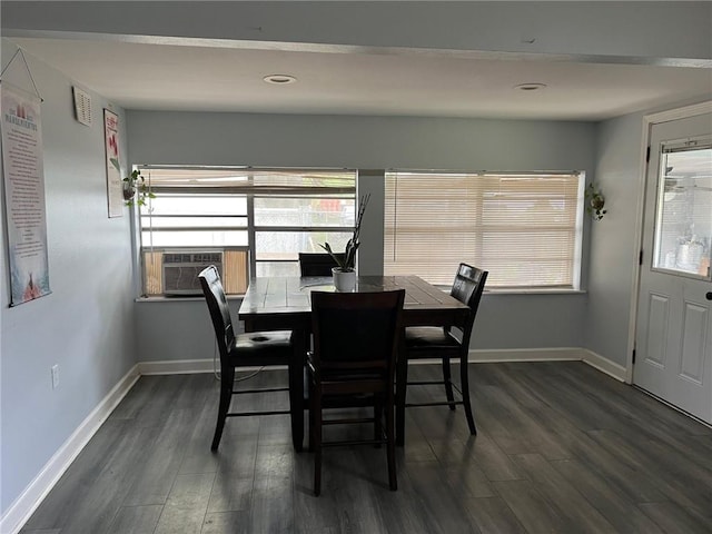 209 10th St, Bridge City, LA 70094 - dining area featuring baseboards, dark wood-style flooring, and plenty of natural light