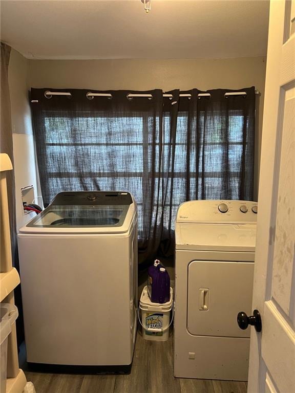 209 10th St, Bridge City, LA 70094 - laundry area featuring washer and dryer, wood finished floors, and laundry area
