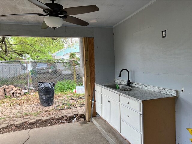 209 10th St, Bridge City, LA 70094 - view of patio / terrace with fence, an outdoor kitchen, a ceiling fan, and a sink