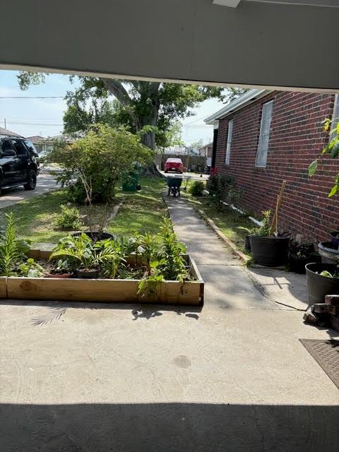 209 10th St, Bridge City, LA 70094 - exterior space featuring a vegetable garden