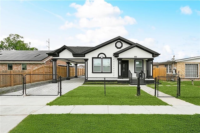 3839 Johnson St, Metairie, LA 70001 - view of front of home featuring a gate, stucco siding, concrete driveway, and a porch