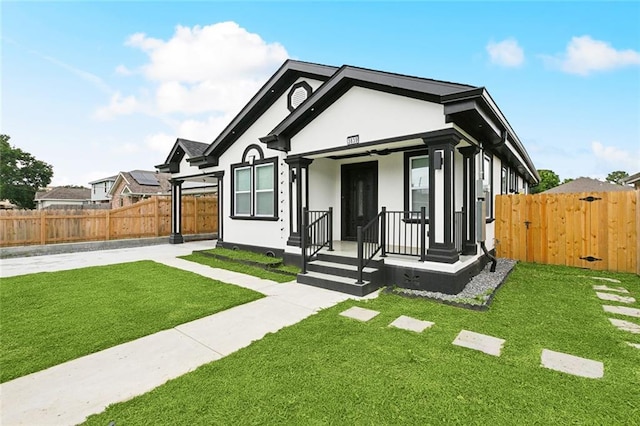 3839 Johnson St, Metairie, LA 70001 - view of front of house featuring stucco siding and a gate