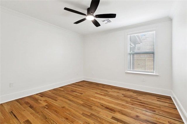 3839 Johnson St, Metairie, LA 70001 - unfurnished room with baseboards, wood finished floors, ceiling fan, and ornamental molding