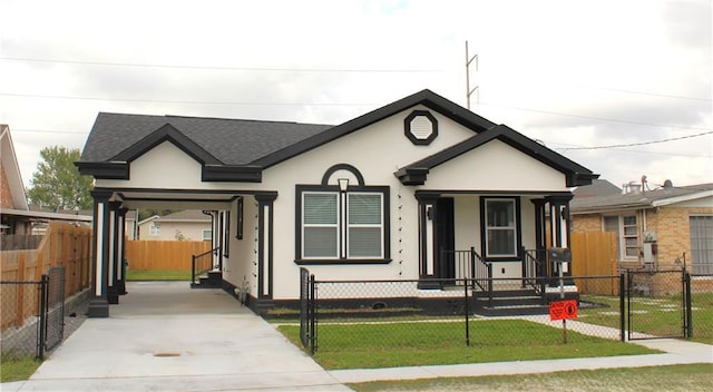 3839 Johnson St, Metairie, LA 70001 - view of front of home with concrete driveway, stucco siding, an attached carport, a porch, and roof with shingles