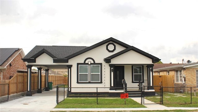 3839 Johnson St, Metairie, LA 70001 - view of front of home featuring stucco siding, a gate, concrete driveway, and a carport