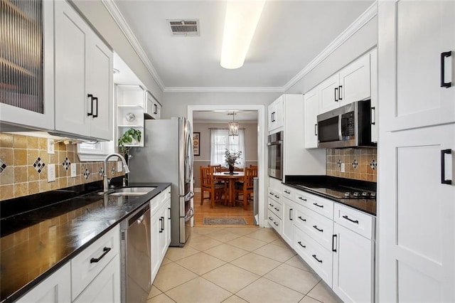 972 Tavel Dr, Kenner, LA 70065 - kitchen featuring visible vents, dark countertops, a sink, and stainless steel appliances