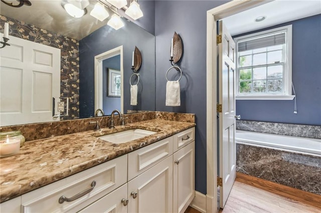 4209 Vendome Pl, New Orleans, LA 70125 - full bath with a bath, wood finished floors, and vanity