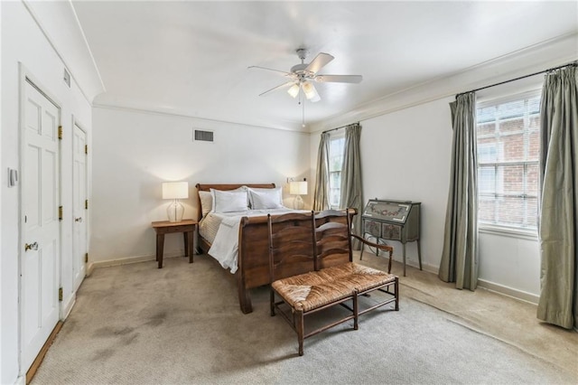 4209 Vendome Pl, New Orleans, LA 70125 - bedroom with crown molding, multiple windows, light colored carpet, and visible vents