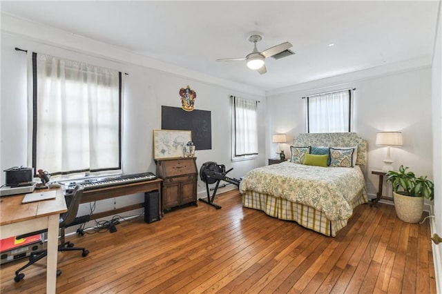4209 Vendome Pl, New Orleans, LA 70125 - bedroom with hardwood / wood-style floors, baseboards, and ceiling fan