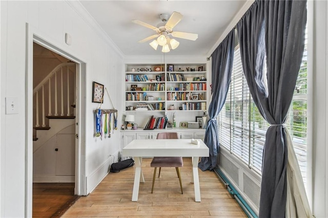 4209 Vendome Pl, New Orleans, LA 70125 - office area featuring light wood-style flooring, built in features, ornamental molding, and a ceiling fan