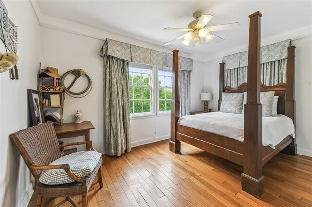 4209 Vendome Pl, New Orleans, LA 70125 - bedroom featuring baseboards, a ceiling fan, and light wood finished floors